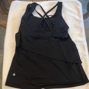 Lululemon size 6 tank top. Black color and built in sports bra.
